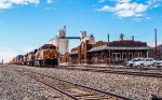 BNSF 8182 leads eastbound stacks past the ex-ATSF depot in Panhandle, TX